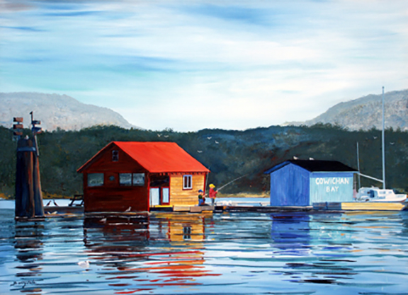 Cowichan Bay on Vancouver Island BC with colorful boat houses on a floating dock.